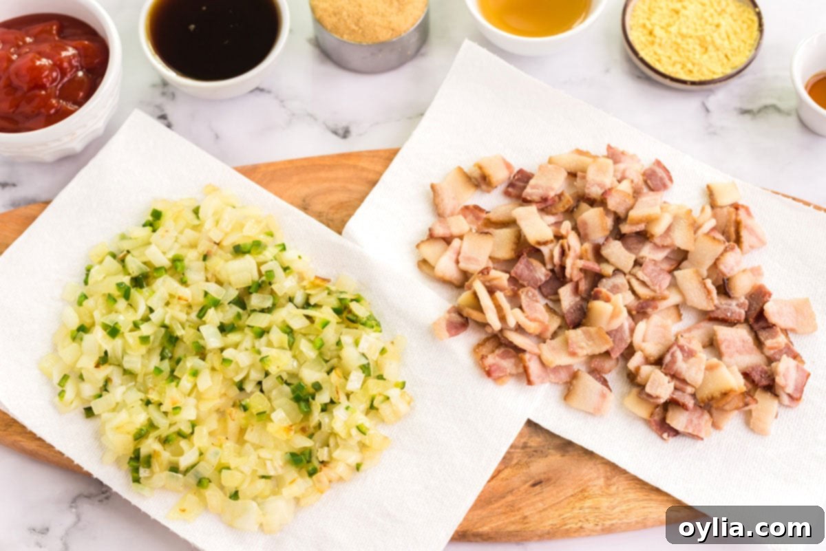 Perfectly Homemade Baked Beans 5 Sautéed onion and jalapeño mixture draining on paper towels alongside partially cooked bacon.