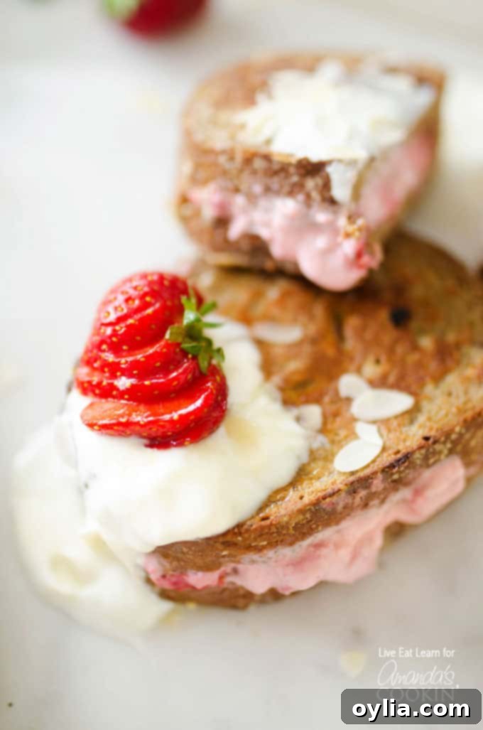 French toast with strawberries and cream cheese, drizzled with syrup