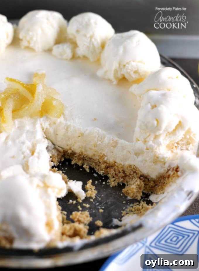A close up of frozen lemonade pie with a slice missing.