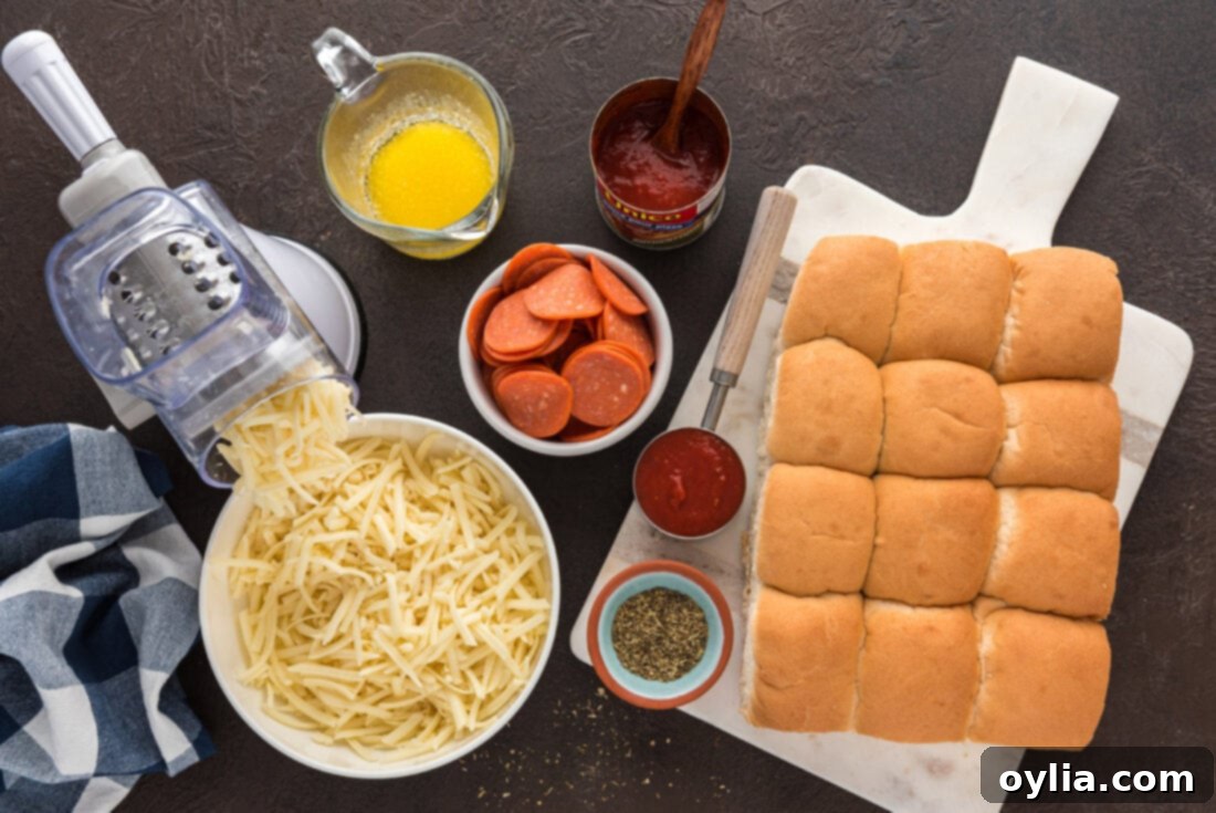 Collection of Ingredients for Pizza Sliders including rolls, pepperoni, cheese, sauce, and butter