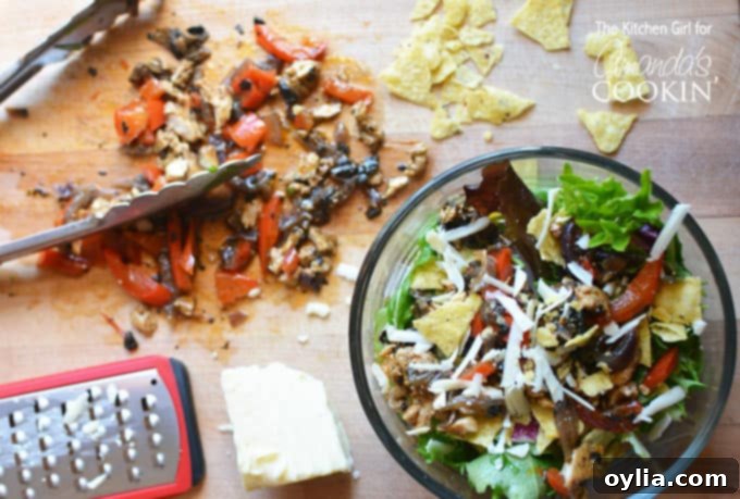 Chicken Fajita Salad served in a bowl with a fork, ready to eat