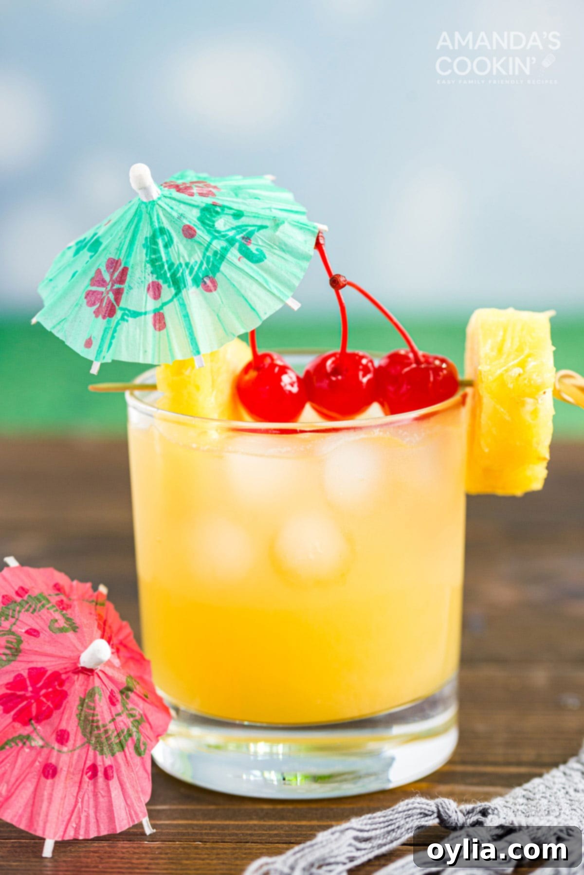 Mai Tai cocktail in a rock glass served with a cocktail umbrella