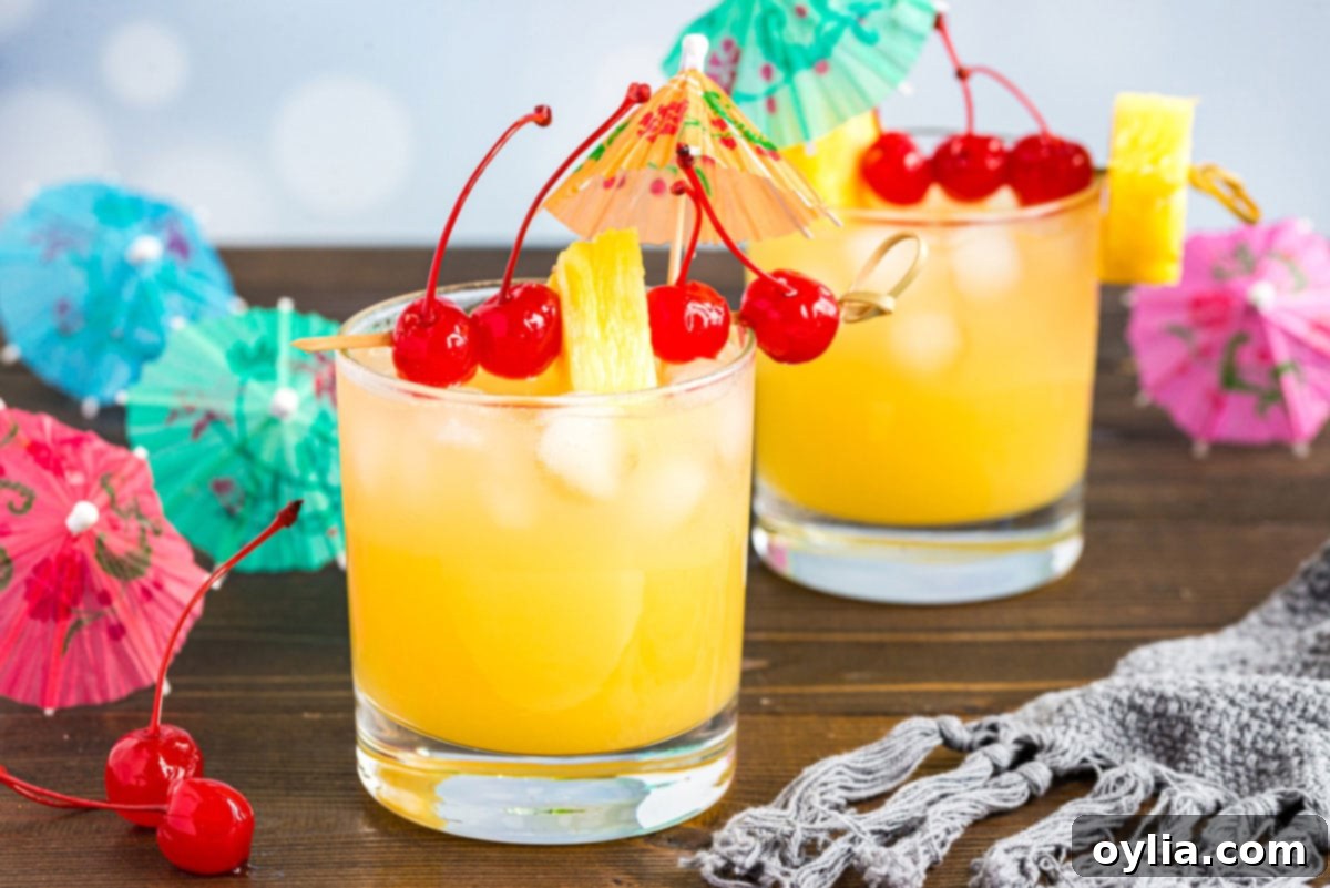 Mai Tai cocktail in a rock glass served with a cocktail umbrella