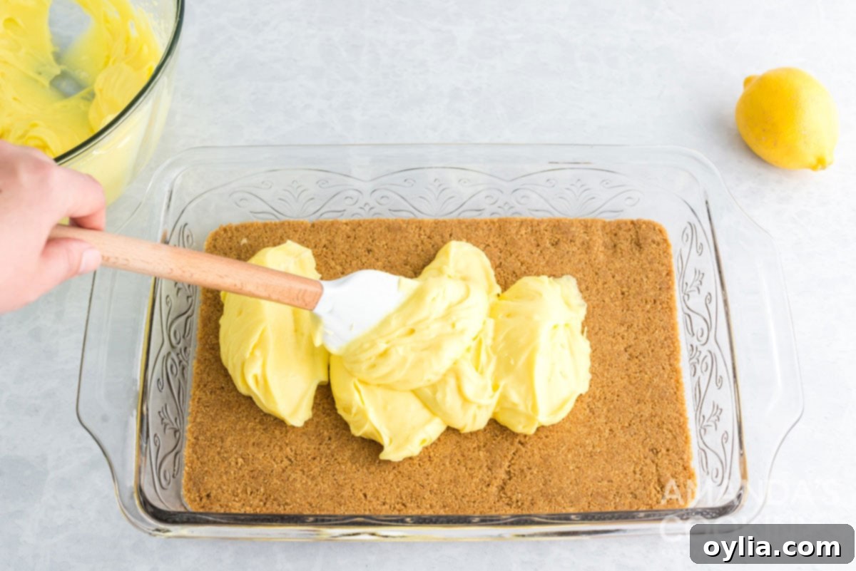 spreading pudding mixture over crust in pan