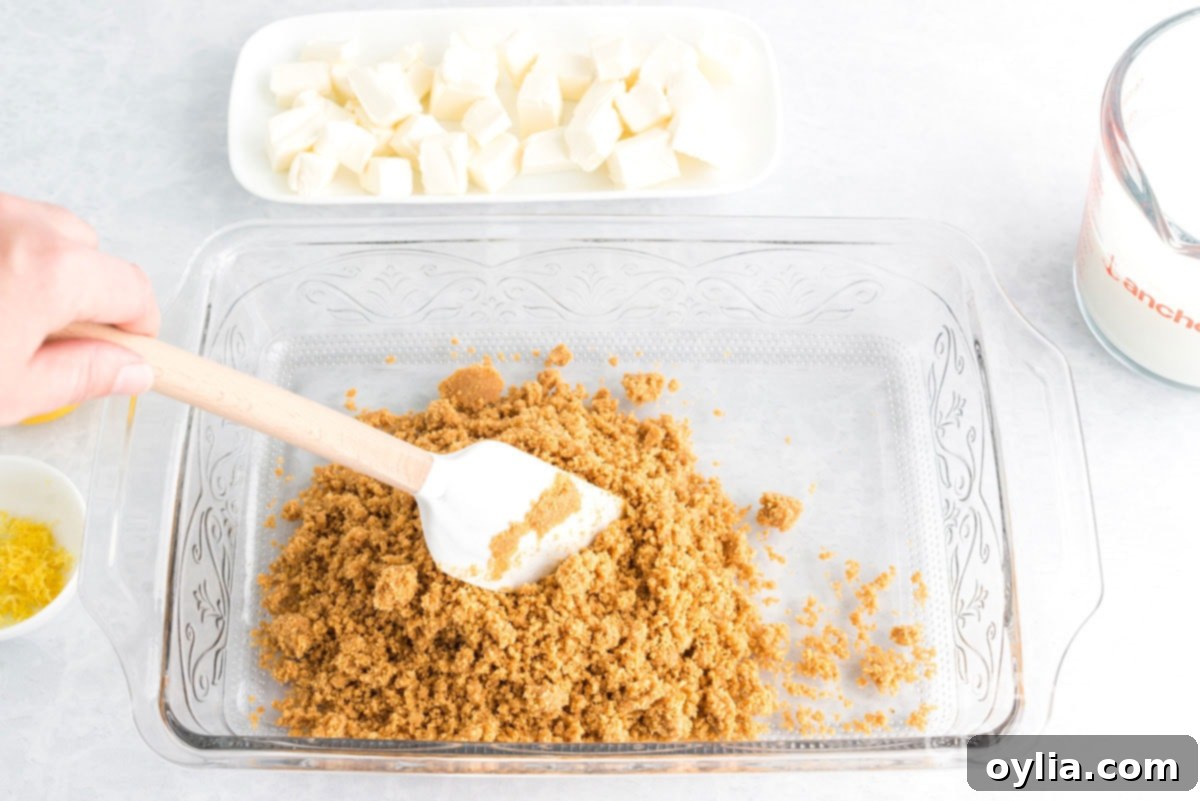 adding crumbs to a baking pan
