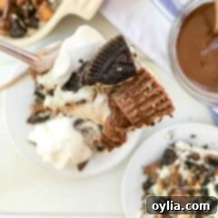 An overhead close up of a forkful of peanut butter cup oreo no bake cheesecake, showcasing the texture and layers.