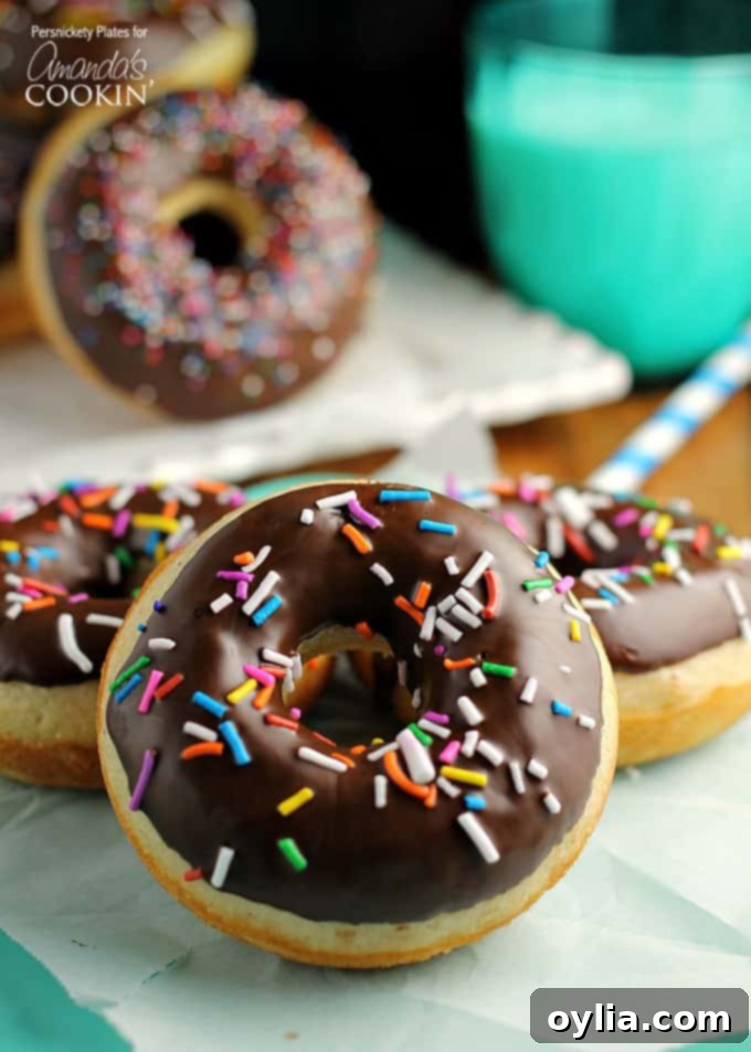 Delicious baked cake donuts recipe with chocolate glaze and sprinkles
