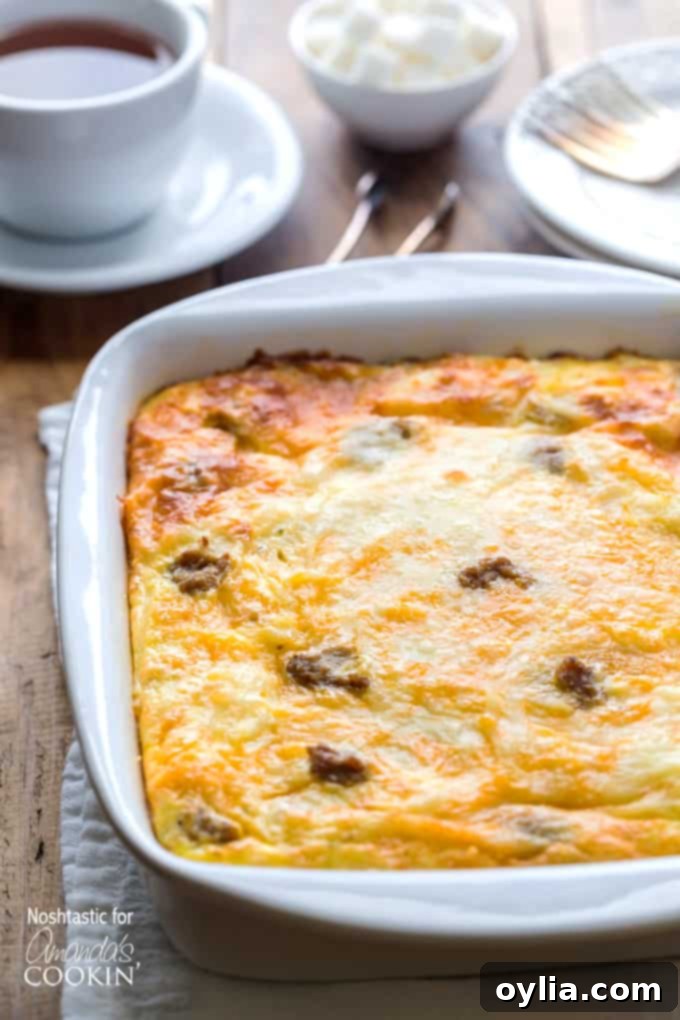 A close up of a white baking dish filled with fresh baked turkey hash brown breakfast casserole