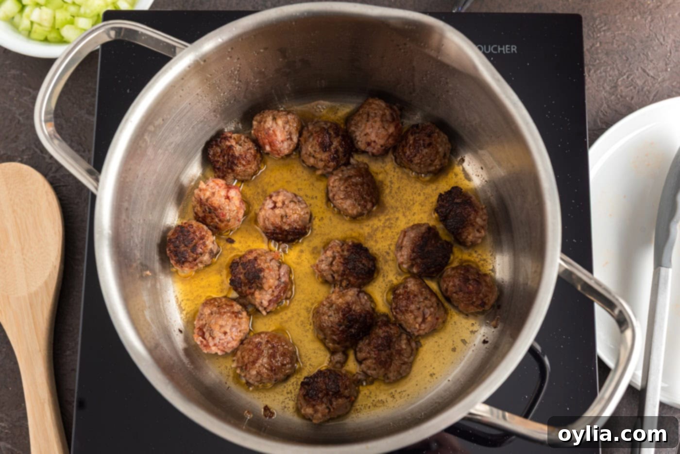 sausage and orzo in a soup pot