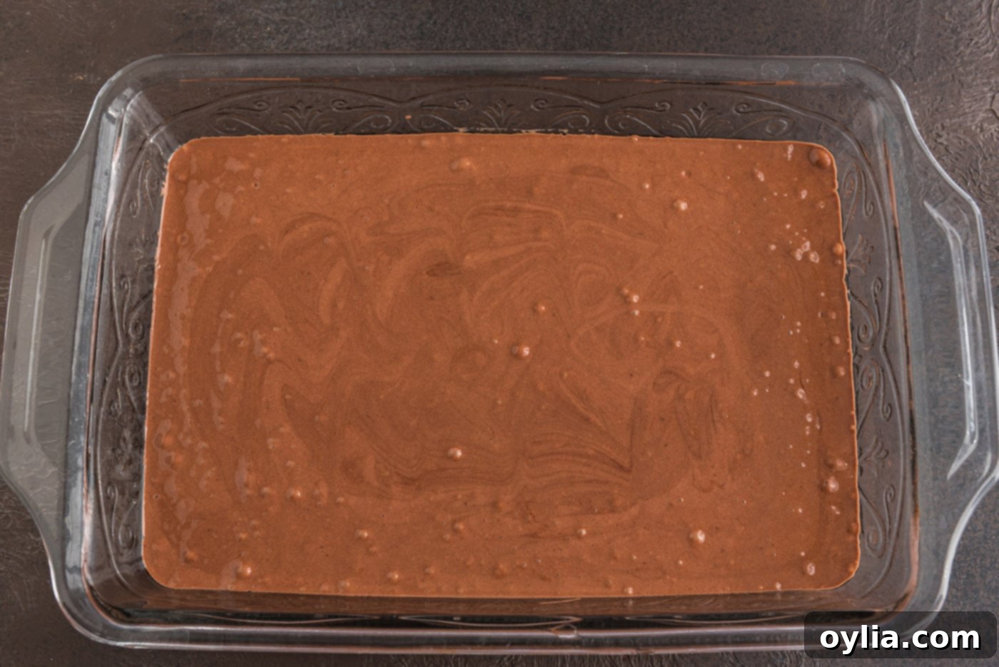 prepared devil's food cake mix evenly spread in a baking dish