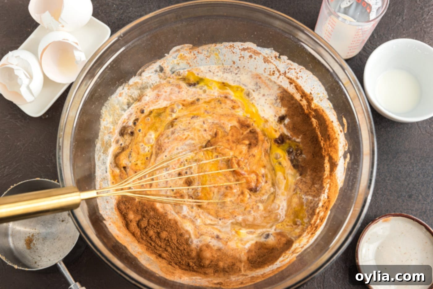 whisking pumpkin pie ingredients together in a bowl until smooth