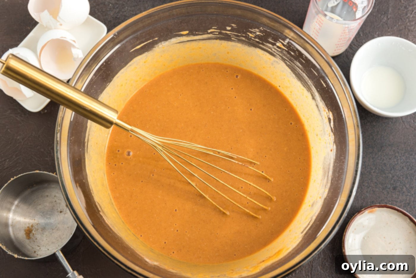 prepared pumpkin pie mix in a bowl, ready to be poured
