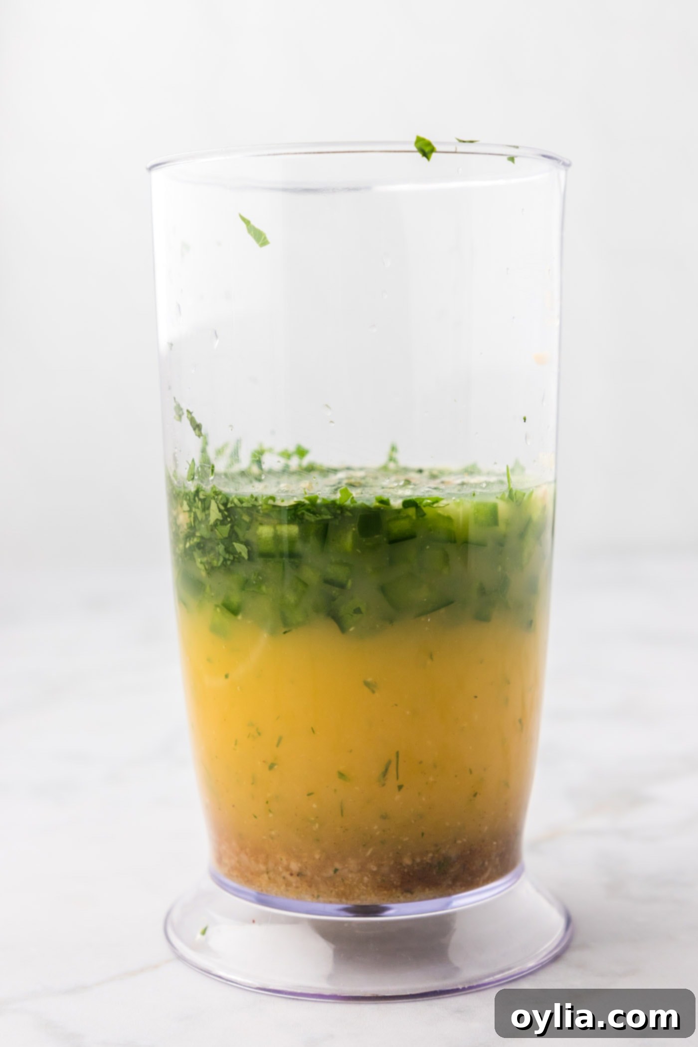 marinade ingredients in an immersion blender container