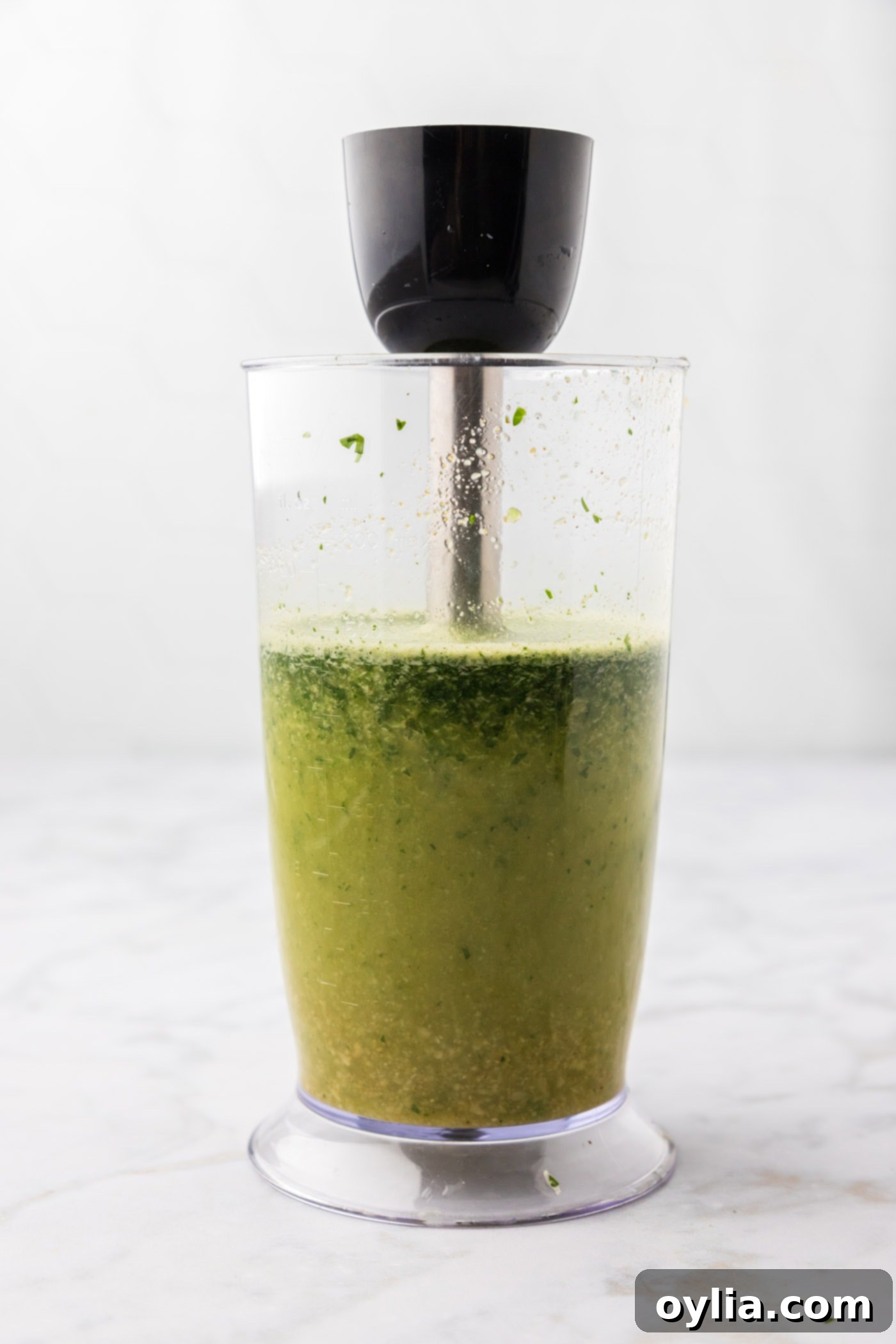 blitzing carne asada marinade with an immersion blender to a smooth consistency