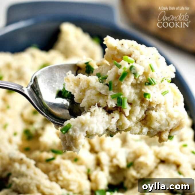 A close up picture of a spoonful of creamy brown butter mashed potatoes.