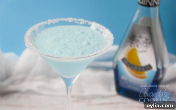 A close up of a blended frostbite martini in a clear martini glass.