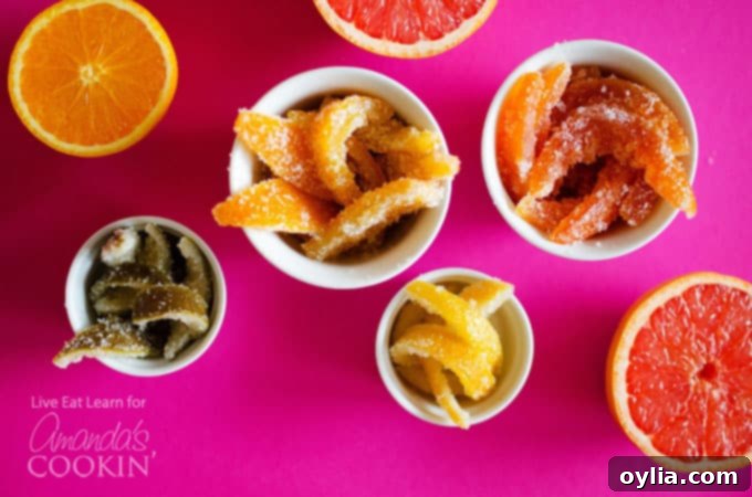 Bowls filled with distinct piles of orange, lemon, grapefruit, and lime candied citrus peels, showcasing the 'rainbow' variety.