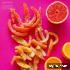 An overhead view of a vibrant assortment of candied grapefruit and orange peels, ready for enjoyment.