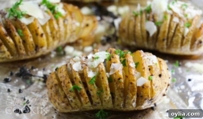 Hasselback potatoes step 3: brushing butter and oil on the sliced potatoes.