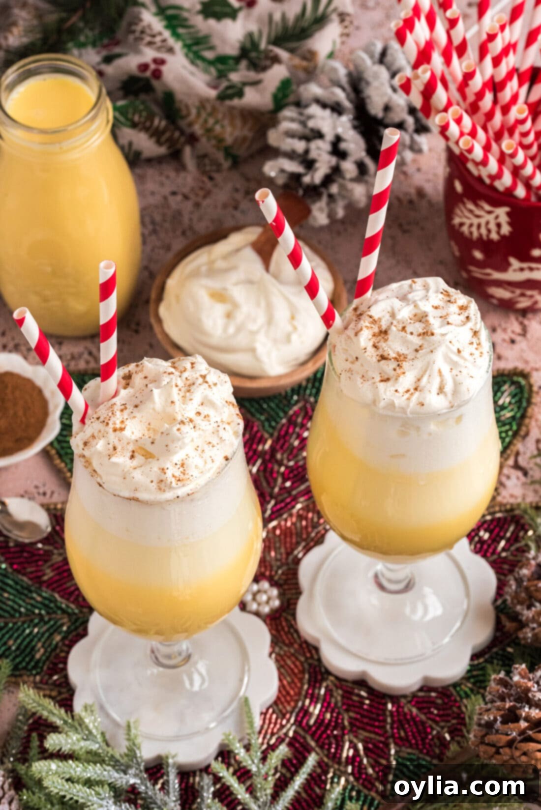 Two Eggnog Floats topped with whipped cream