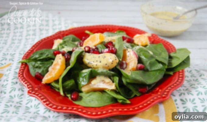 A beautifully arranged Pomegranate Clementine Salad, ready to be served, highlighting the fresh ingredients.