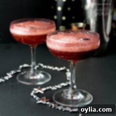 New Year Champagne Creations 2 Full champagne glass featuring a Blackberry Rum Champagne Cocktail, ready to be enjoyed.