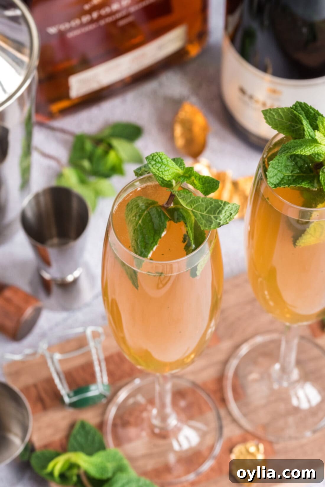 Two Fizzy Julep cocktails on a wooden board