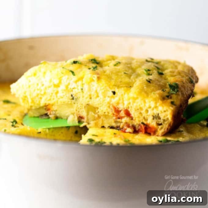 A serving of vegetable frittata on a spatula.