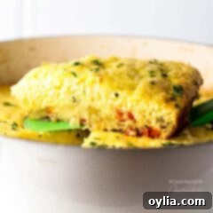 Garden Vegetable Frittata 5 A serving of vegetable frittata on a spatula.