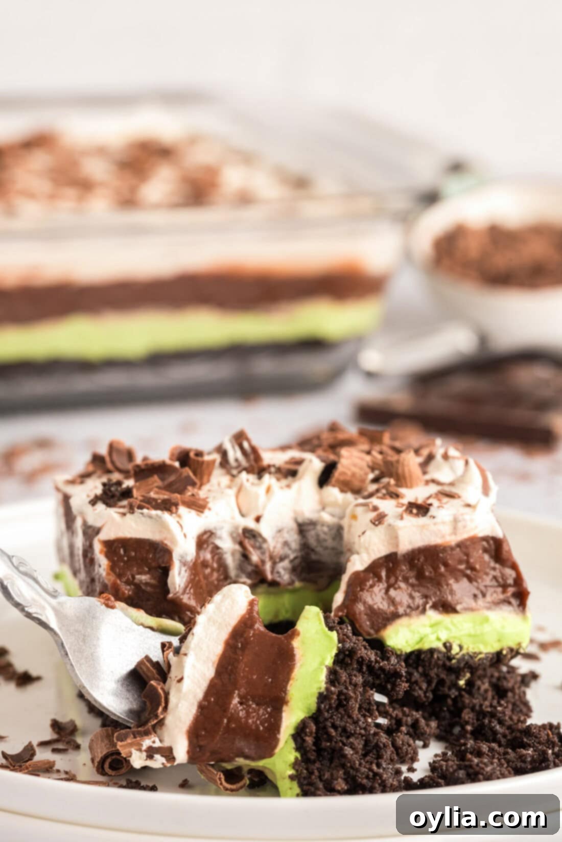 Fork breaking apart a piece of Mint Chocolate Lasagna