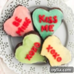 heart shaped decorated brownies on a plate