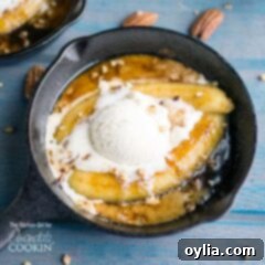 Single serve banana foster topped with vanilla ice cream in a 5" skillet.
