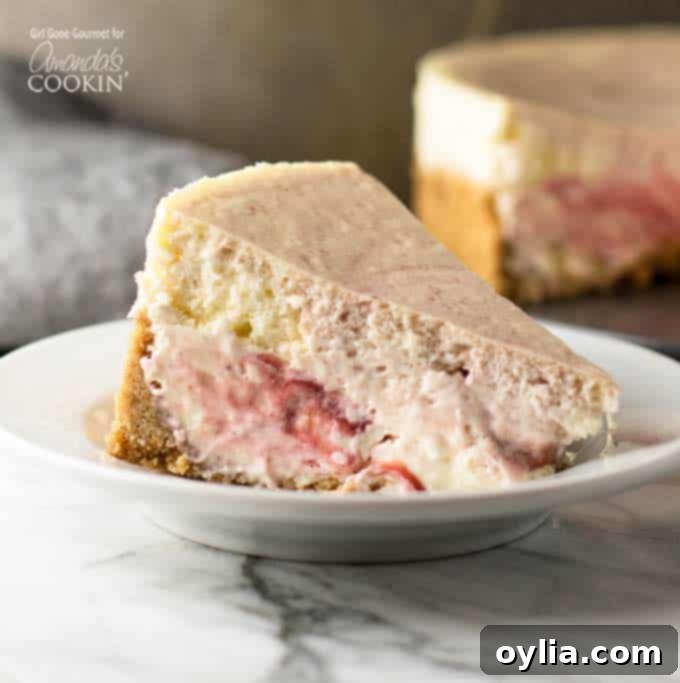 A perfectly portioned slice of creamy strawberry swirl cheesecake, showcasing the rich filling and vibrant berry ribbons, resting elegantly on a white plate.