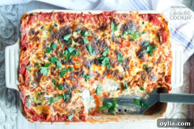 Garden Veggie Lasagna 4 pan of veggie lasagna, slice removed, spatula where slice was