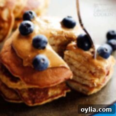 Naturally Sweet Banana Stacks 5 fork with a stack of delicious flourless banana pancakes