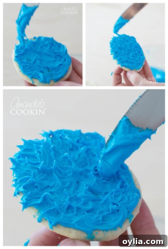 A close-up of blue frosted sugar cookies with edible eyeballs, in the process of becoming Cookie Monster cookies, ready to top a freak shake.