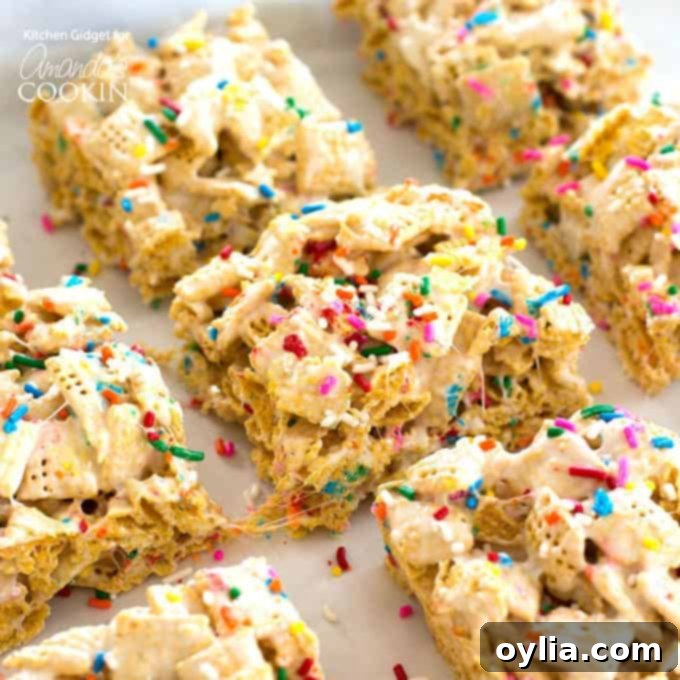 Close-up of a single Funfetti Marshmallow Cereal Bar, showcasing its soft, chewy texture and colorful sprinkles on a white background.