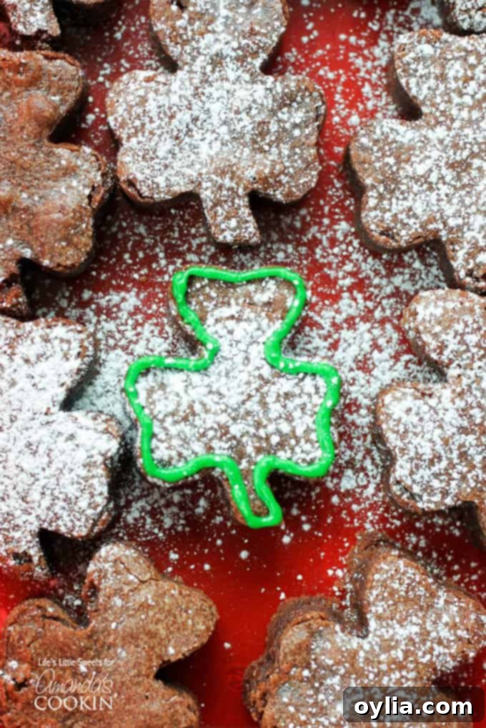 Close-up of freshly baked shamrock shaped brownies, showcasing their rich texture