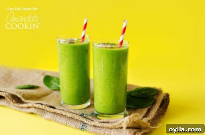 Green smoothies on yellow background with paper straws
