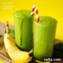 two green smoothies with straws
