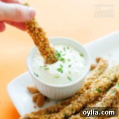 asparagus fries being dipped in sauce