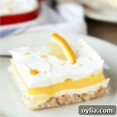 A piece of layered lemon dessert on a plate