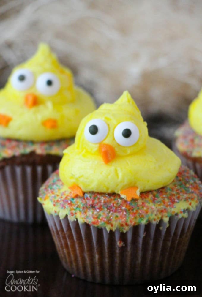 These cute Easter Chick Cupcakes are a quick & easy Easter dessert, fit to feed a crowd! Great for a holiday gathering or as a fun recipe to do with kids. #cupcakes #easter #easterdessert #spring #cupcakerecipes #easterrecipes Adorable Easter themed cupcakes with chick decorations