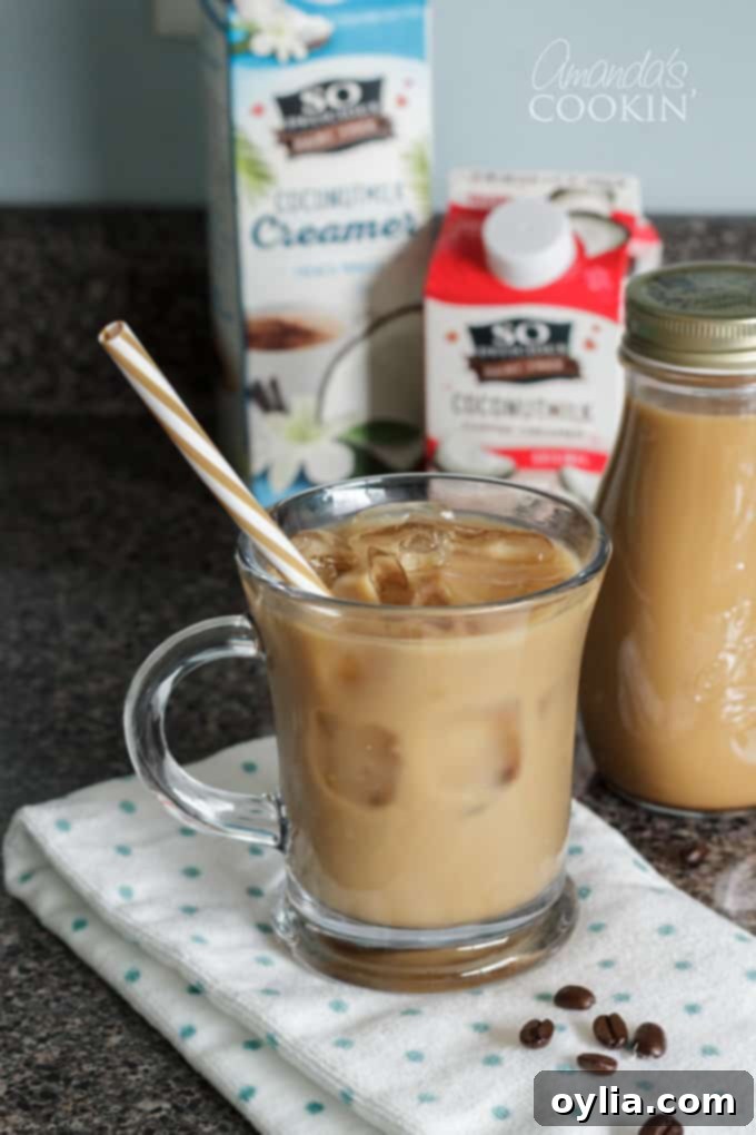 paper straw in a glass of cold brewed iced coffee