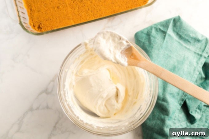 cream cheese and cool whip mixed in a bowl