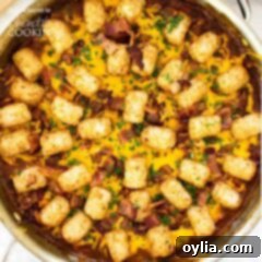 Loaded BBQ Chicken Tater Tot Skillet 3 tater tot casserole garnished with bacon and parsley