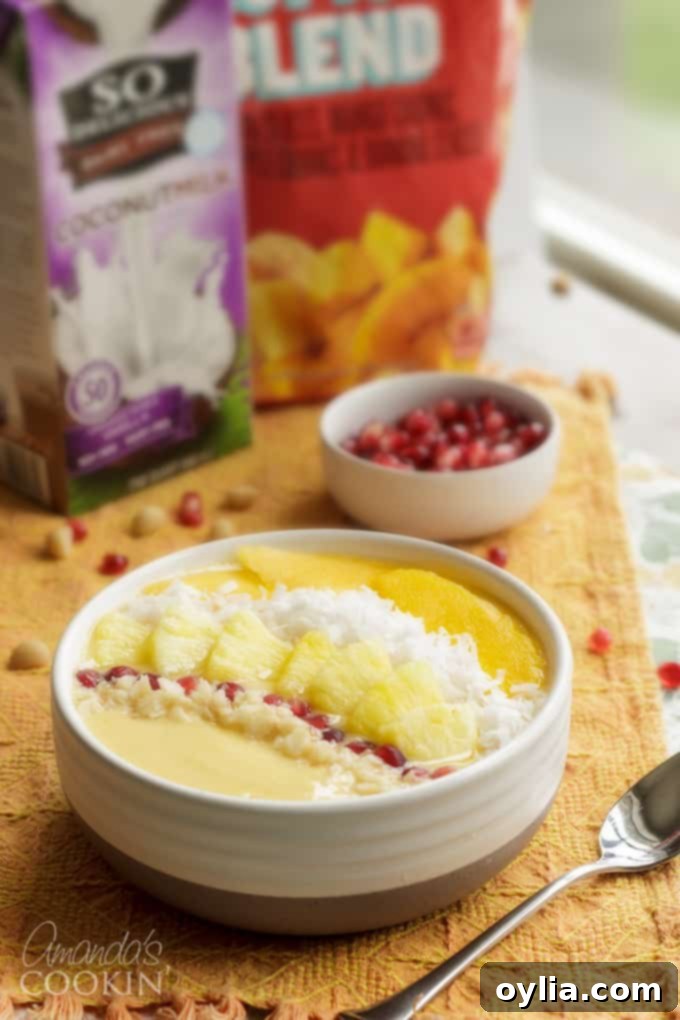 Close-up of a tropical smoothie bowl, showcasing its creamy texture and fresh fruit toppings.