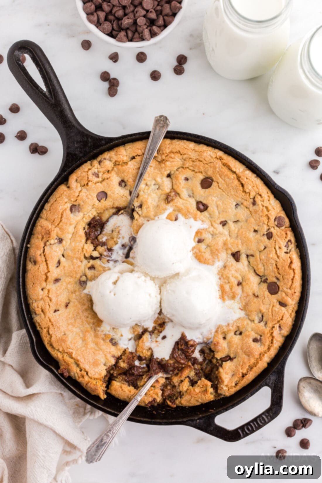 chocolate chip cookie in a skillet with vanilla ice cream