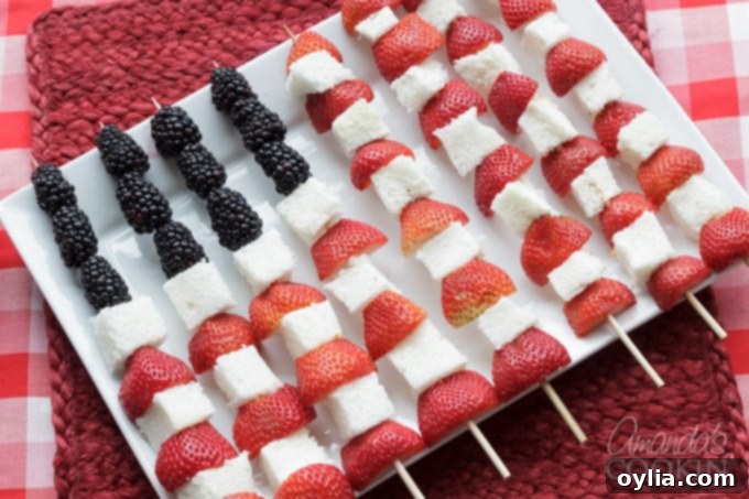 Fourth of July American Flag Fruit Kabobs with strawberries, blueberries, and angel food cake