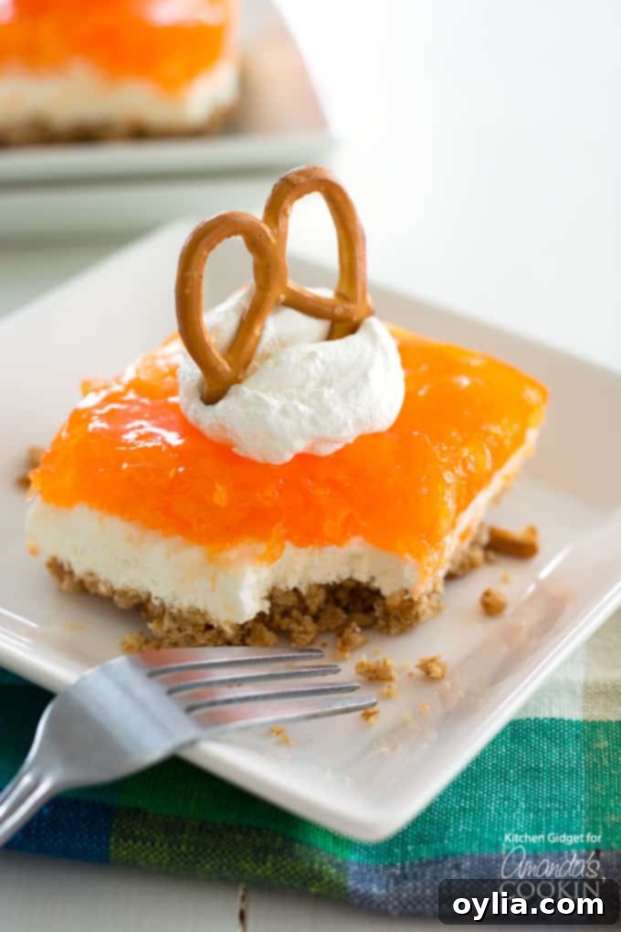 Mandarin Orange Pretzel Salad - a refreshing layered dessert perfect for summer gatherings.